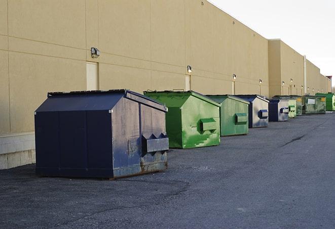 large garbage containers clustered on a construction lot in Pattersonville